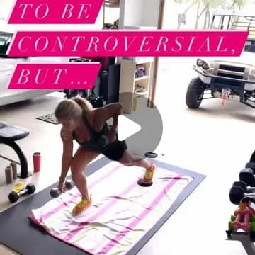 Andrea in her garage gym starting a floor mobility flow.